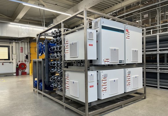 Priva Vialux M-Line 32 water treatment system in clean industrial setting with pipes and safety gear.